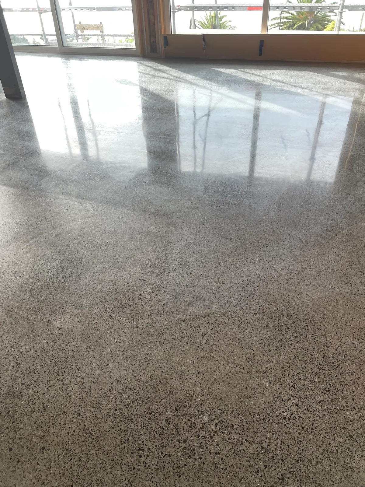 Salt and pepper polished concrete finish in Redcliffs